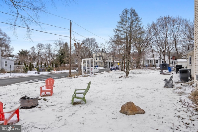 snowy yard with central AC unit