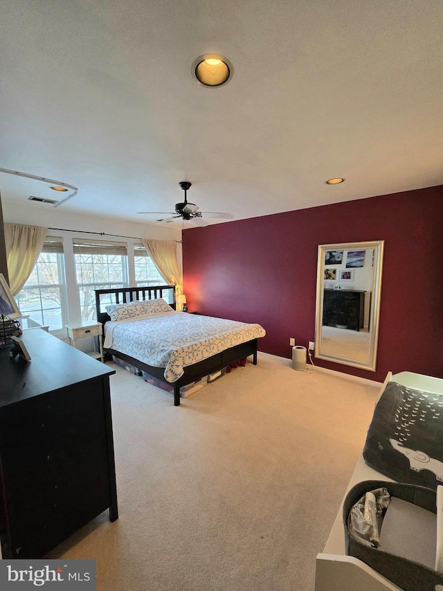 carpeted bedroom featuring ceiling fan