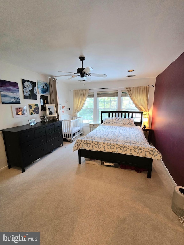 carpeted bedroom with ceiling fan