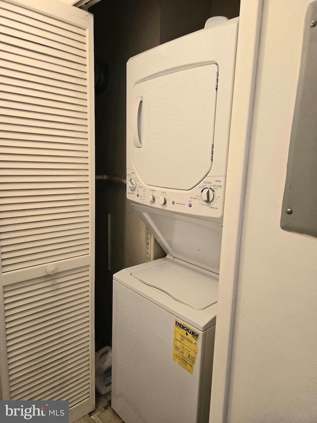 laundry room featuring stacked washer and dryer