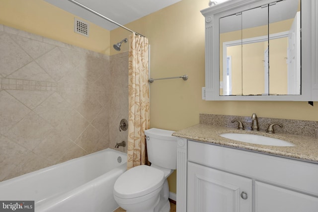 full bathroom with shower / bathtub combination with curtain, vanity, and toilet