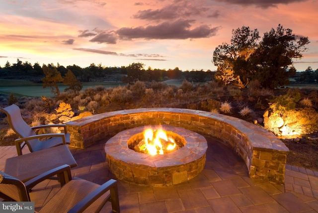 patio terrace at dusk with a fire pit