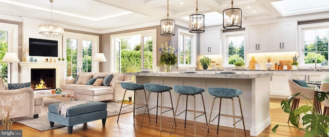 bar featuring white cabinetry, an inviting chandelier, and pendant lighting