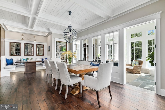 dining space featuring wood-type flooring, ornamental molding, and beam ceiling