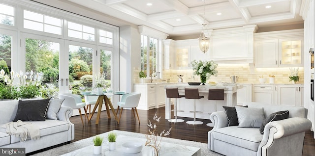 sunroom / solarium with a notable chandelier, coffered ceiling, beam ceiling, and sink