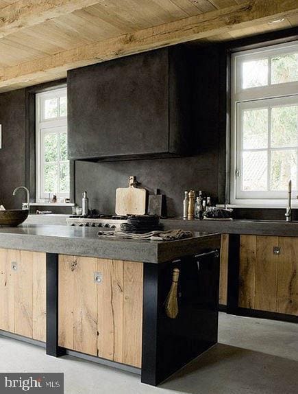 kitchen featuring sink, decorative backsplash, beam ceiling, and wooden ceiling