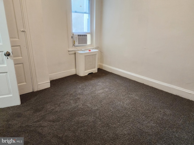 carpeted empty room with radiator