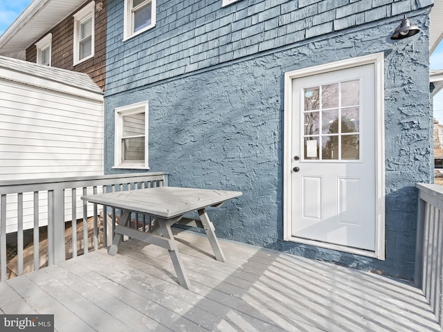 entrance to property with a deck