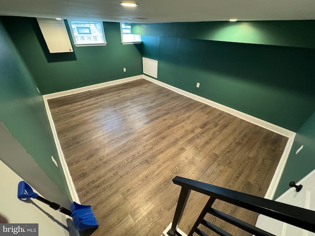 basement with hardwood / wood-style flooring