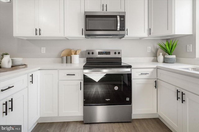 kitchen with white cabinetry and appliances with stainless steel finishes