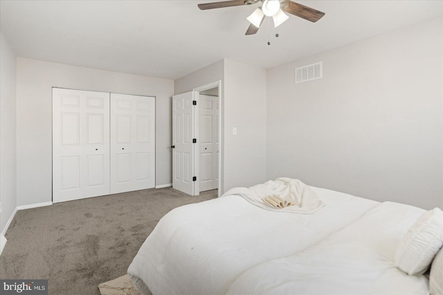 bedroom with carpet, ceiling fan, and a closet