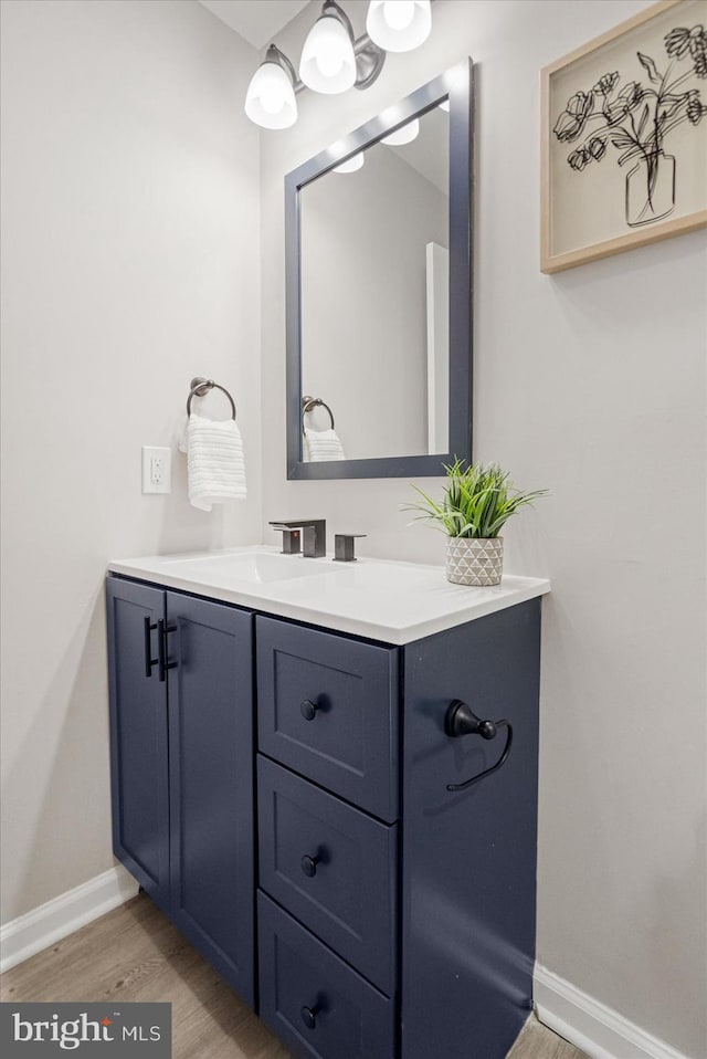 bathroom featuring vanity and hardwood / wood-style floors