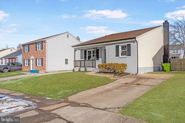 view of front of house featuring a front yard and covered porch