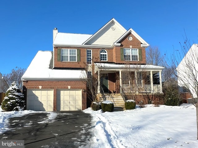 view of front facade featuring a garage and covered porch