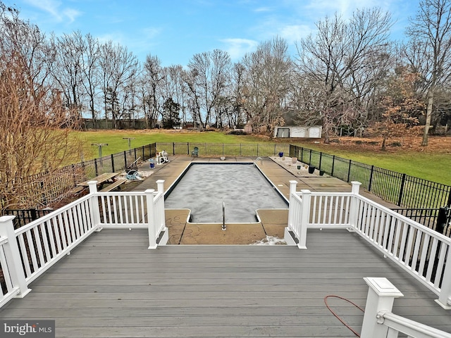 deck featuring fence and a yard