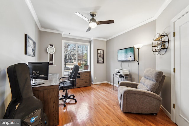 office area featuring crown molding, ceiling fan, and light wood-type flooring