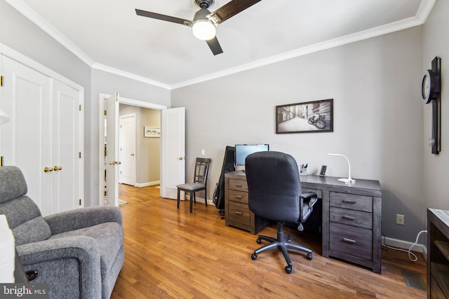 office with crown molding, ceiling fan, and light hardwood / wood-style flooring