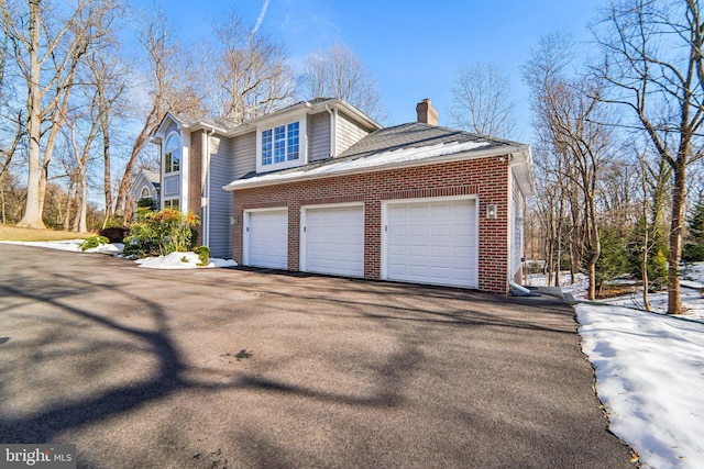 view of property exterior featuring a garage