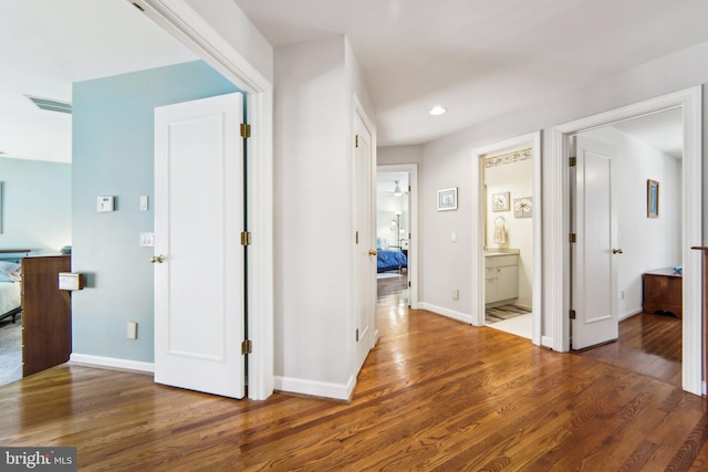 hall with dark wood-type flooring