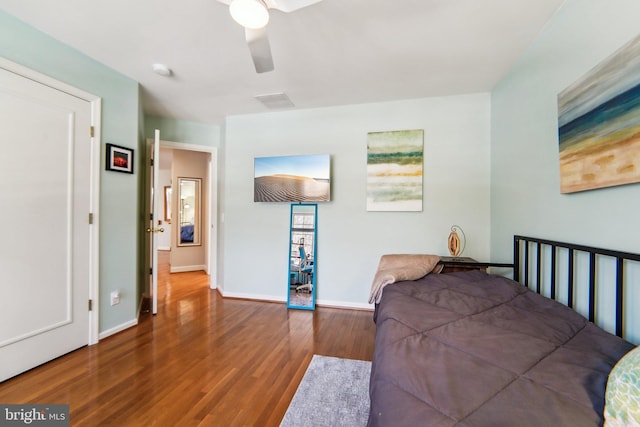 bedroom with wood-type flooring and ceiling fan