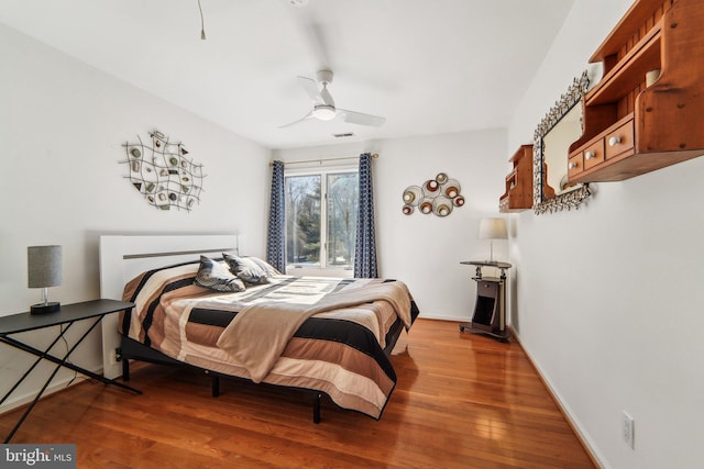 bedroom with hardwood / wood-style flooring and ceiling fan