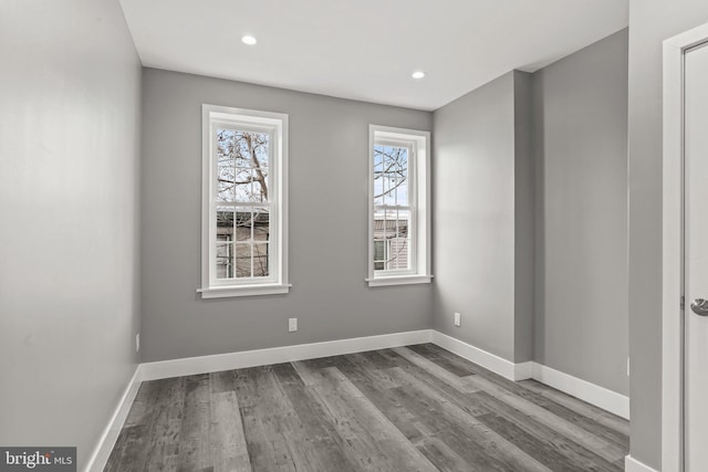 spare room with hardwood / wood-style floors