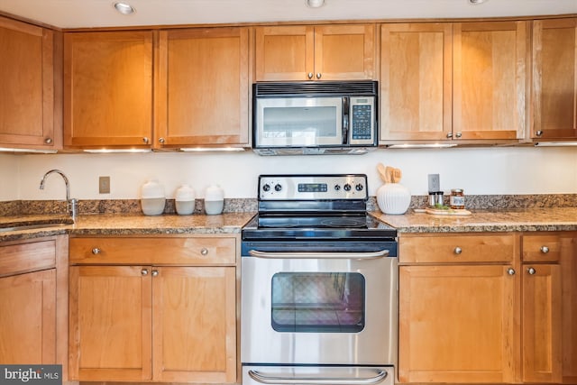 kitchen featuring appliances with stainless steel finishes and sink