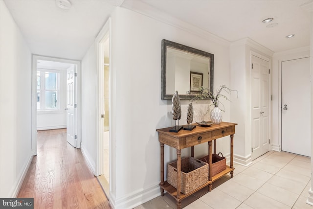 hallway featuring light tile patterned floors