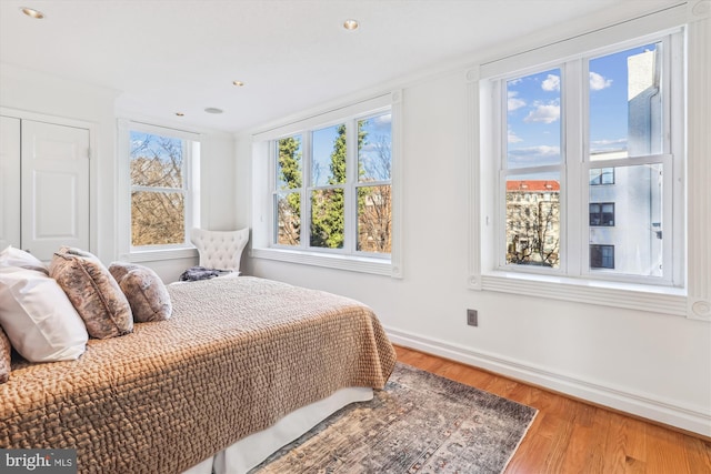 bedroom with hardwood / wood-style flooring