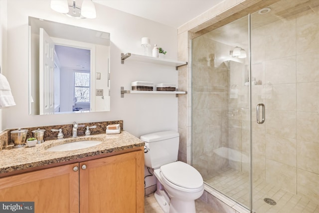 bathroom with vanity, toilet, and walk in shower