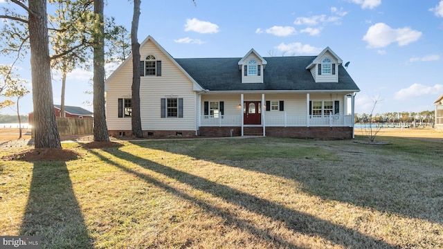 cape cod house with a porch and a front lawn