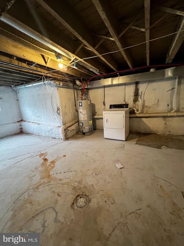 basement featuring washer / clothes dryer and water heater