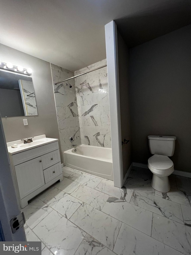 full bathroom with toilet, vanity, and tiled shower / bath