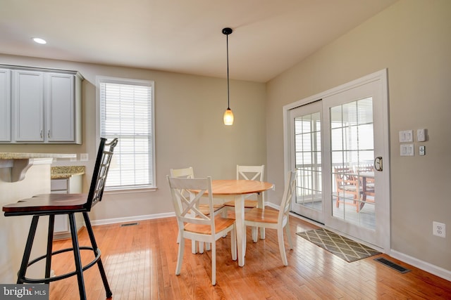 dining space with light wood-type flooring