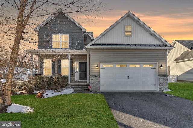 view of front of house with a lawn and a garage