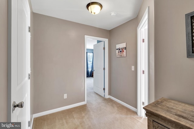 hallway with light carpet