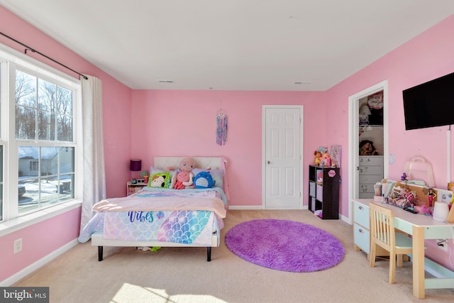 bedroom featuring light colored carpet