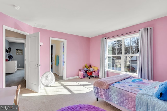 bedroom with light colored carpet