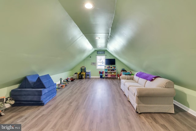 interior space featuring light hardwood / wood-style flooring and lofted ceiling