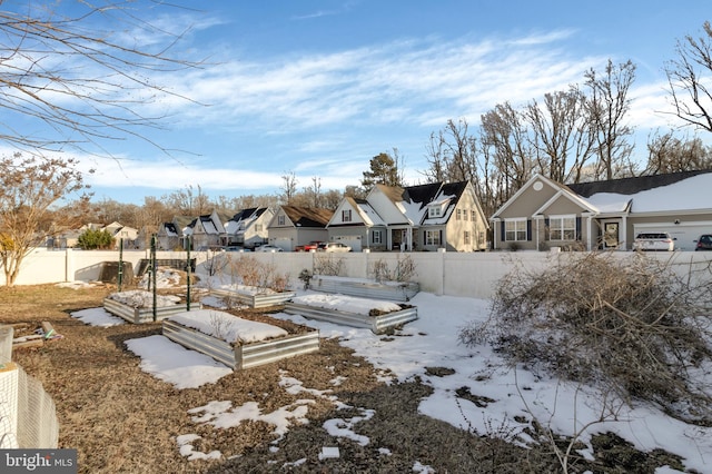 view of yard layered in snow