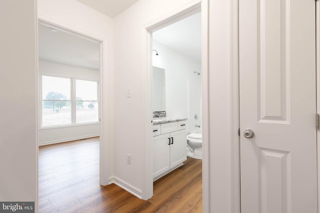 hallway with light wood-type flooring