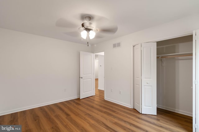 unfurnished bedroom featuring a closet, ceiling fan, and wood-type flooring