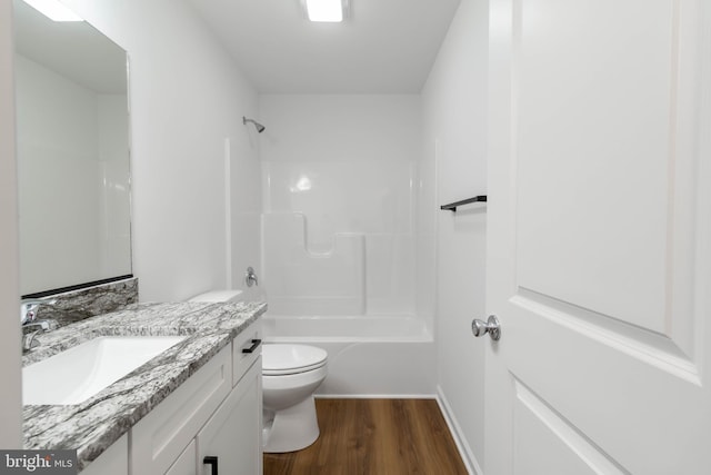 full bathroom featuring vanity, toilet, tub / shower combination, and wood-type flooring