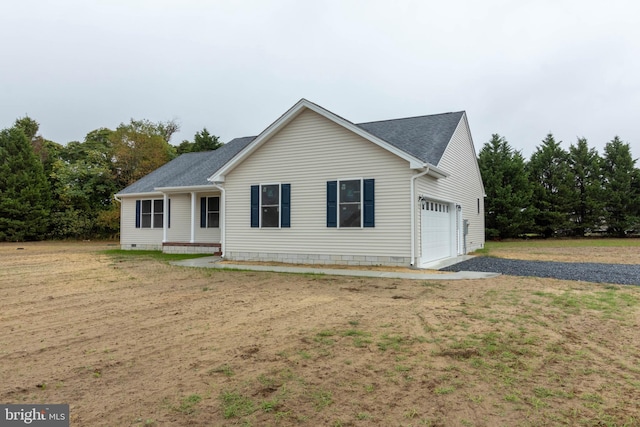 view of front of property with a garage and a front lawn