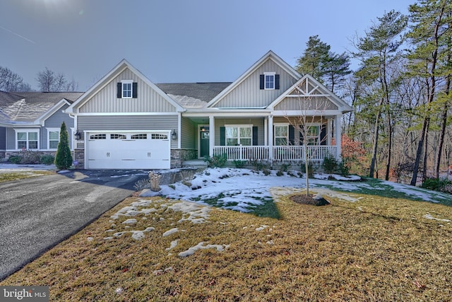 craftsman-style home with a garage and covered porch