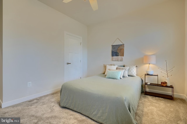 bedroom featuring light colored carpet and ceiling fan