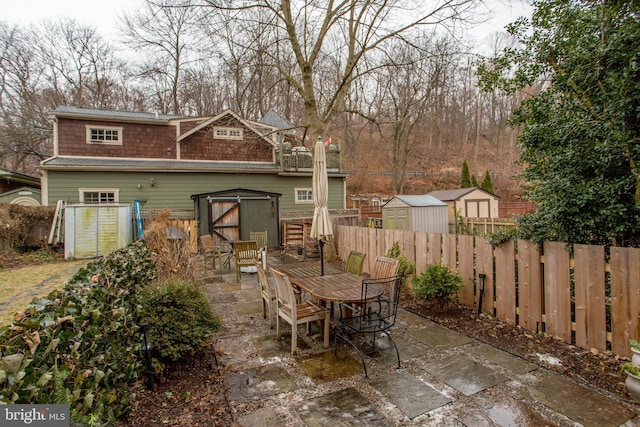 view of patio with a storage unit