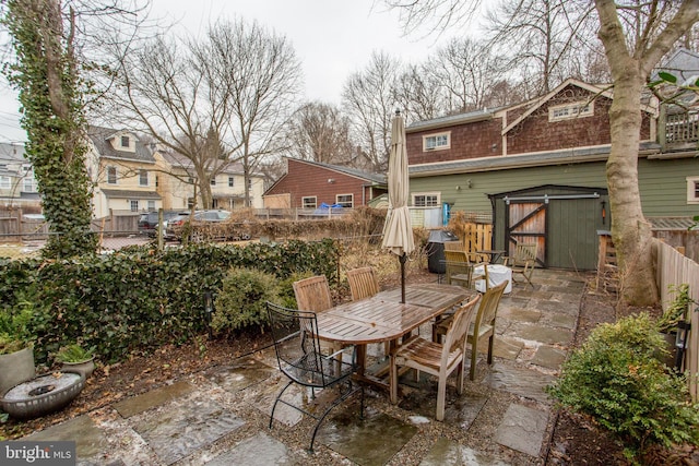 view of patio / terrace featuring a shed