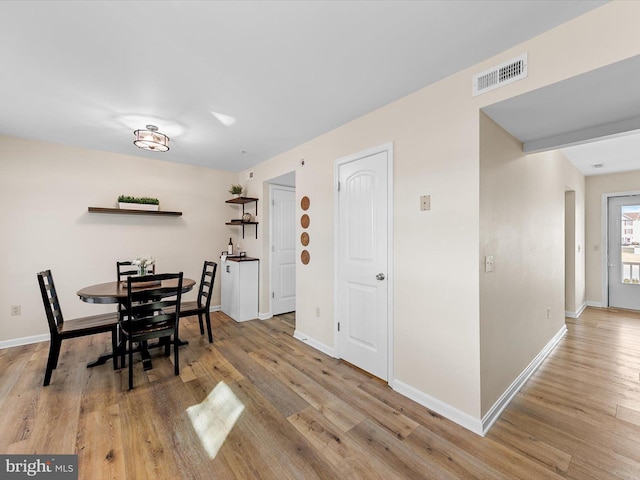 dining area with light hardwood / wood-style flooring