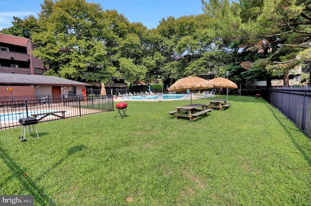 view of yard with a community pool